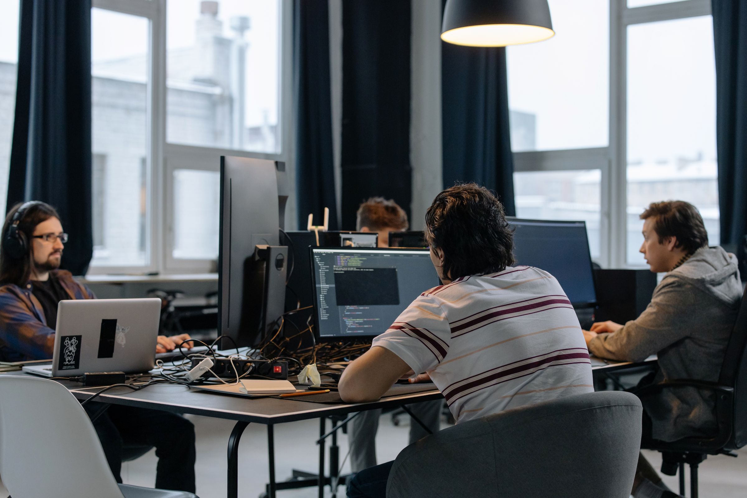 Software engineer working on application code at a desk