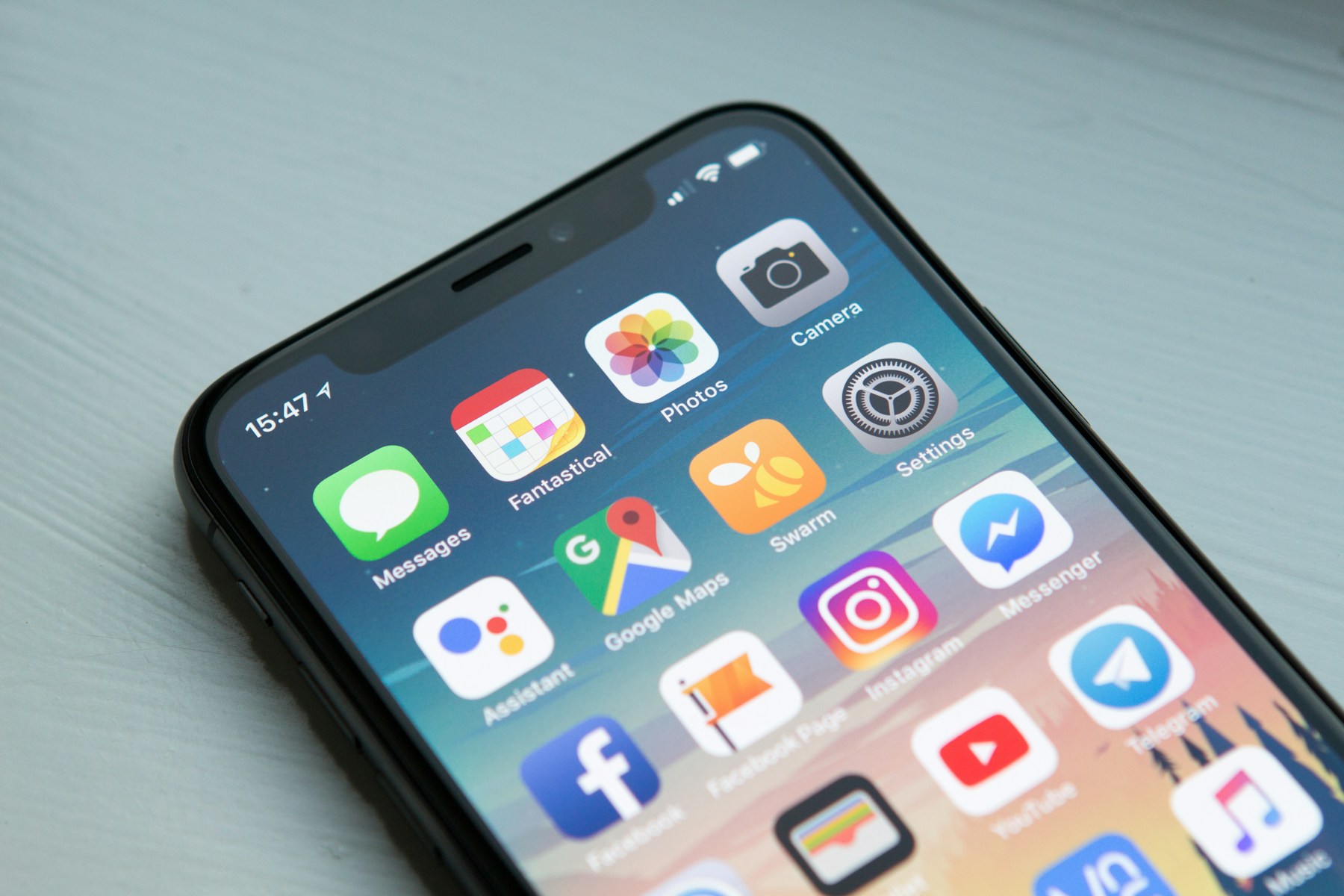 Close-up of a real smartphone displaying mobile applications